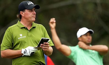 Tiger Woods and Phil Mickelson wait on the 12th tee during the second round of the US Open at the Torrey Pines