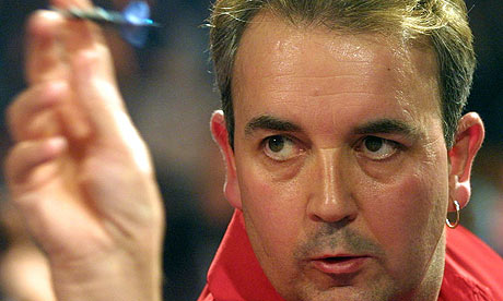Phil Taylor in action against John Part during the world darts final in 2003