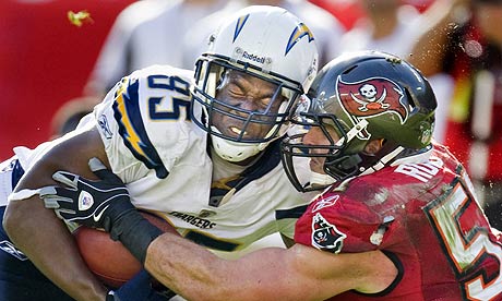 Buccaneers' Ruud and Chargers' Gates collide during second half of their NFL football game in Tampa