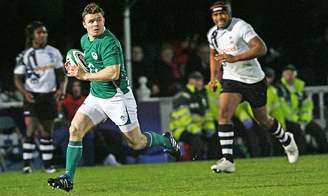 Brian O'Driscoll scores an interception try for Ireland against Fiji