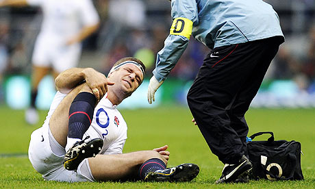 Joe Worsley clutches his knee after the first ruck of the game against New Zealand