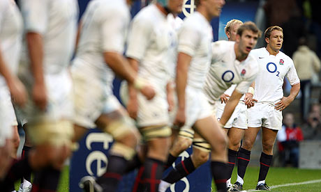 England's Jonny Wilkinson stands dejected behind the try line after an Australian try