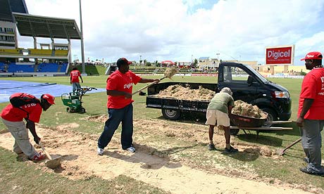 Groundsmen get to work after play is abandoned in the second Test between England and West Indies