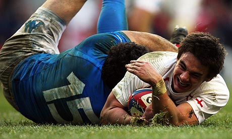 Harry Ellis dives past Andrea Masi of Italy to score a try for England