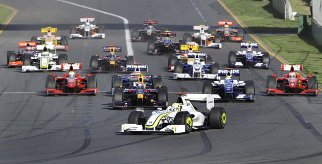 Australian grand prix: Jenson Button leads into turn one
