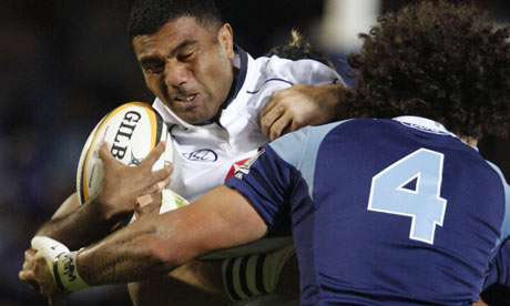 Wycliff Palu of New South Wales Waratahs is tackled by Kurtis Haiu of New Zealand's Auckland Blues