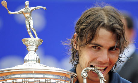 rafael nadal images. Rafael Nadal bites his trophy