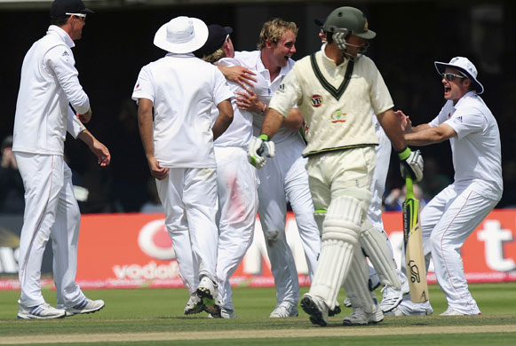 Ashes second Test: Stuart Broad is mobbed by his team-mates after bowling Ricky Ponting