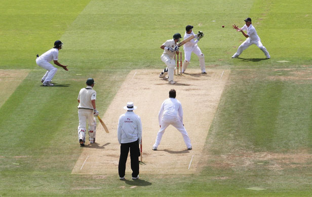 Ashes second Test: Michael Hussey is caught by Paul Collingwood off a Graeme Swann delivery