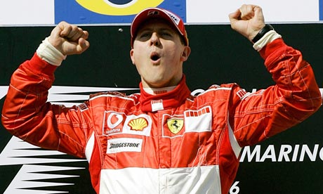Michael Schumacher celebrates on the podium after winning the San Marino 