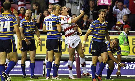 Joel Tomkins of Wigan Warriors celebrates his try