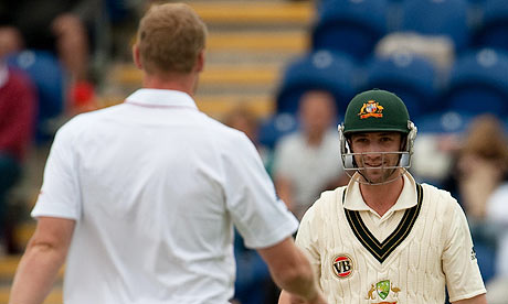 Australia's Philip Hughes smiles after ducking a bouncer from England's Andrew Flintoff