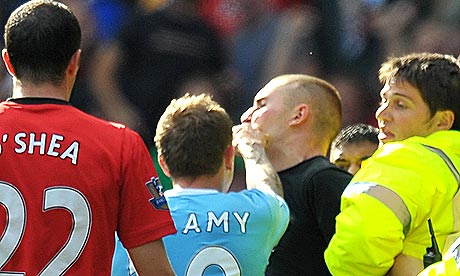 Craig Bellamy gers into an altercation with a Manchester United fan after yesterday's derby