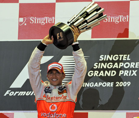 Singapore GP: Lewis Hamilton lifts the trophy