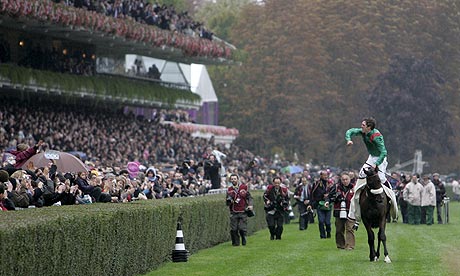 Christophe Soumillon celebrates on Arc winner Zarkava