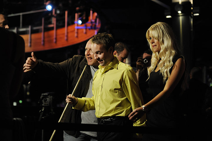 Power Snooker: Alistair Carter walks to the table with Power Girl Danni
