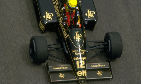 Ayrton Senna in the old blackandgold Lotus a colour scheme that will 