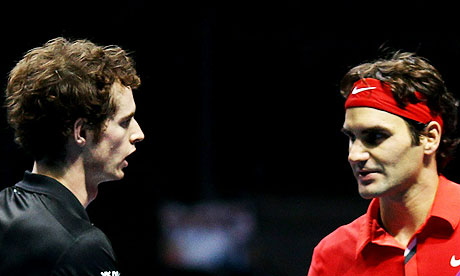 Andy Murray, left, shakes hands with Roger Federer after his defeat at the ATP World Tour Finals