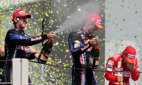 Vettel, Webber and Alonso celebrate after the Brazilian F1 Grand Prix at the Interlagos racetrack