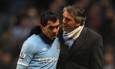Carlos Tevez and roberto mancini