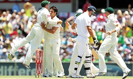 Mitchell Johnson is congratulated by Australia team-mates after dismissing England's Kevin Pietersen