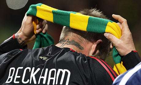 Beckham puts on a Green and Gold scarf