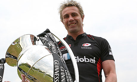 Justin Marshall of Saracens poses with the Guinness Premiership trophy