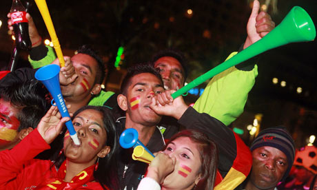 Spain supporters blow vuvuzelas at the D
