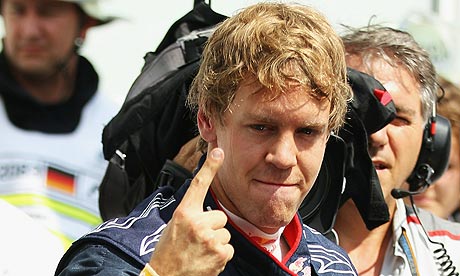 Sebastian Vettel celebrates after claiming pole position in Hockenheim