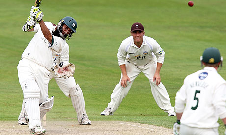 Worcestershire's Moeen Ali lofts a ball from Surrey's Gareth Batty and is caught by Matthew Spriegel