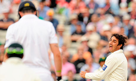 Saeed Ajmal celebrates after catching Kevin Pietersen