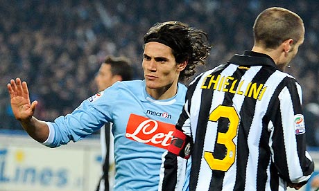 Edinson Cavani, left, passes Giorgio Chiellini as he celebrates scoring for Napoli against Juventus