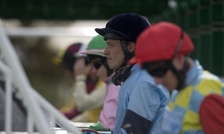 Jockeys in the starting stalls