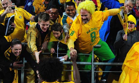 Australia's Radike Samo of Australia celebrates with fans 