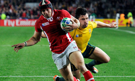 Wales's Leigh Halfpenny scores a try under pressure from Adam Ashley-Cooper