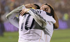 Landon Donovan and David Beckham of LA Galaxy celebrate winning MLS Cup