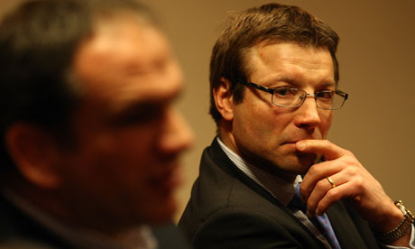 Rob Andrew looks on as Martin Johnson, then England team manager, talks to the press in March 2011