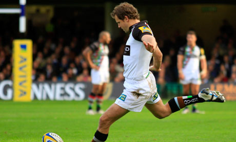 Harlequins' Nick Evans kicks a successful conversion against Bath.