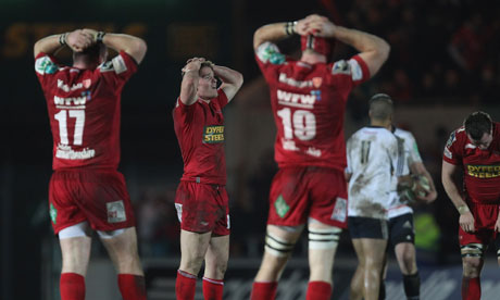 Scarlets' Phil John, Tavis Knoyle and Kieran Murphy  look dejected after losing to Munster