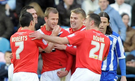 Huddersfield's Jordan Rhodes, centre, celebrates 