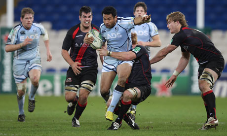 Cardiff's Casey Laulala, centre, is held up by Roddy Grant of Edinburgh.