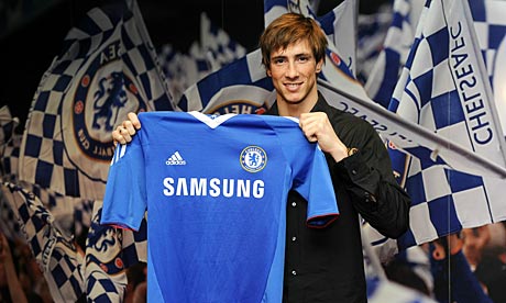 torres in chelsea shirt. with a Chelsea shirt after