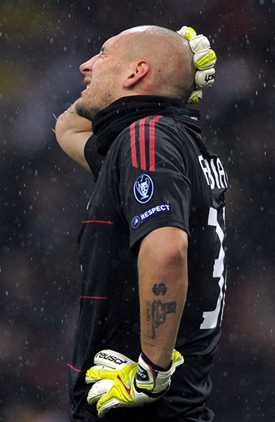 Milan v Spurs: Chistian Abbiati holds his head after being injured