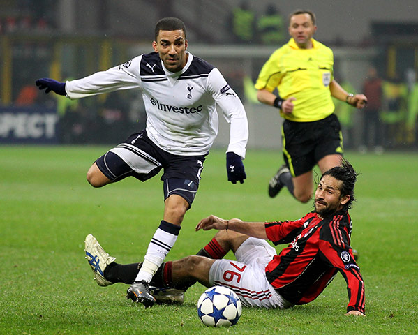 Milan v Spurs: Aaron Lennon skips over the challenge of Mario Yepes