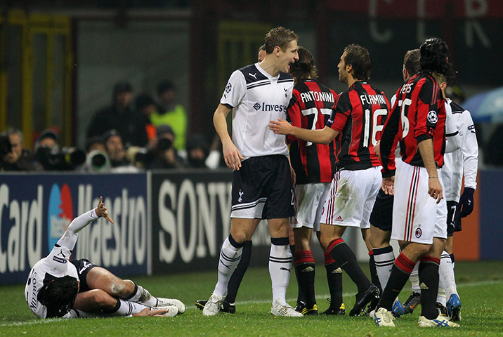 Milan v Spurs: Vedran Corluka lies injured after being fouled by Mathieu Flamini