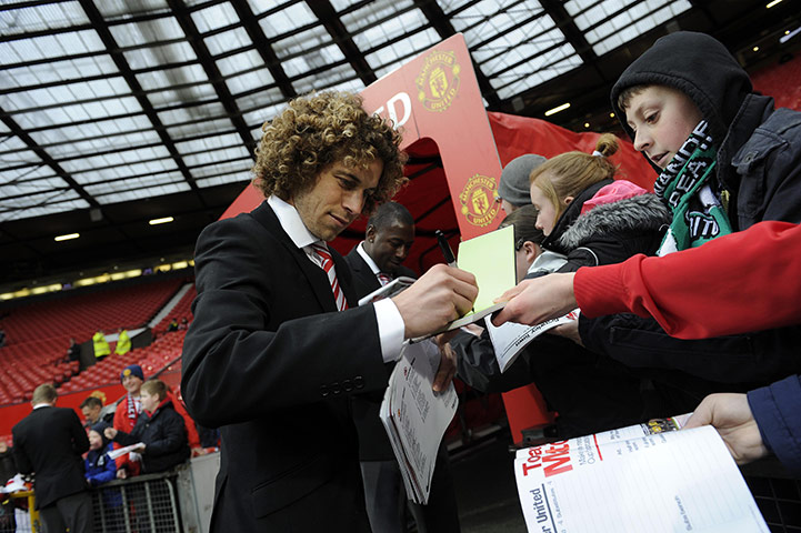 Man Utd v Crawley: Sergio Torres signs autographs for United fans before the game