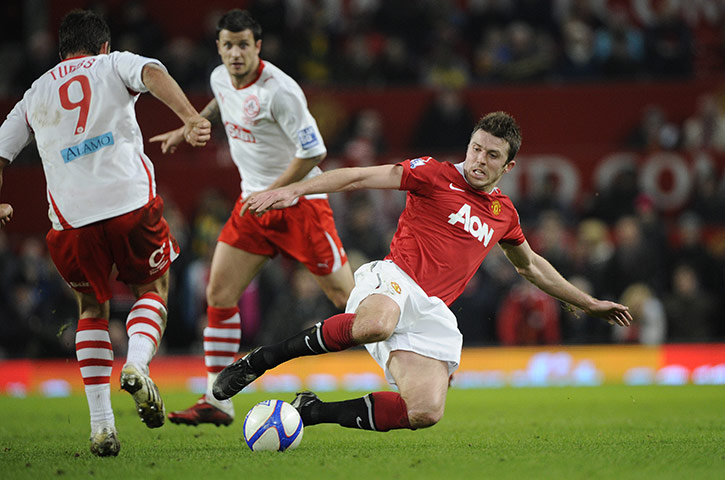 Man Utd v Crawley: Michael Carrick flies into tackle Matt Tubbs