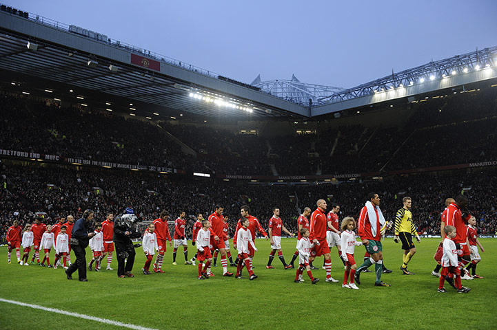 Man Utd v Crawley: The teams enter on to the pitch