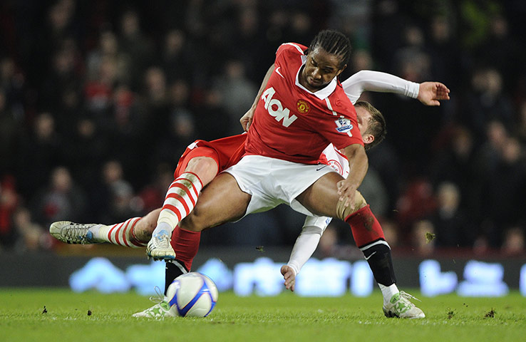 Man Utd v Crawley: Anderson tussles with Danny Bulman