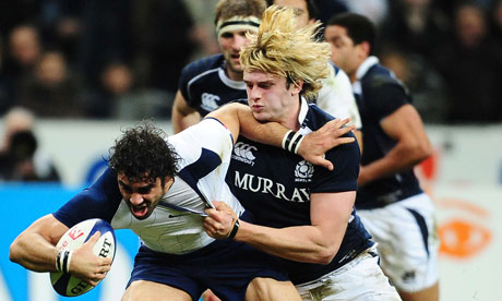 France's right wing Yoann Huget (L) vies